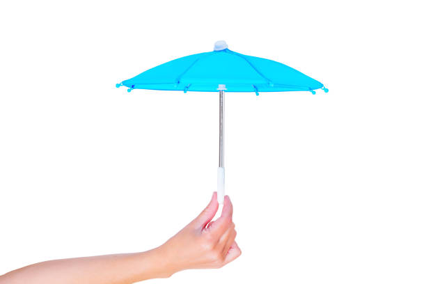 istock Hand Holds an Open Blue Toy Umbrella 1498357215