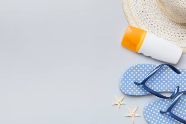 istock Summer vacation concept flat lay. straw hat beach accessories and towel top view. Space for text. travel concept 1498361097