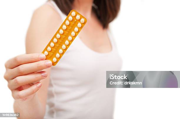 Closeup Of Strip Of Birth Control Pills Held Up By Woman Stock Photo - Download Image Now