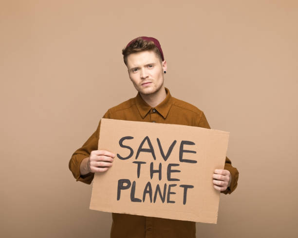 istock Male activist holding a banner 1498366139