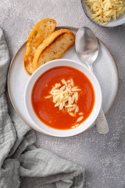 istock Greek tomato soup with orzo pasta and ciabatta bread 1498367558