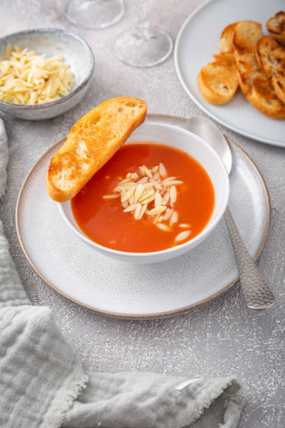 istock Greek tomato soup with orzo pasta and ciabatta bread 1498367559