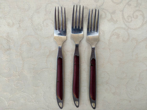 istock Several vintage forks arranged uniquely on the table 1498384208