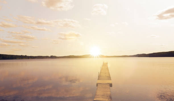 istock Bathing jetty on a lake at sunset 1498384845