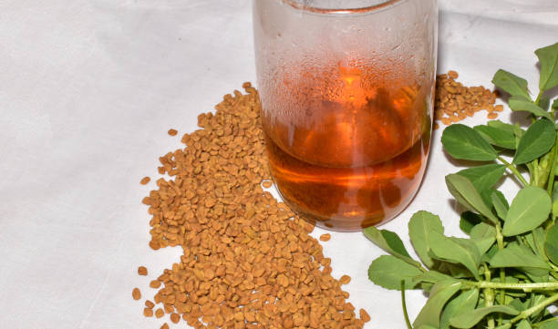 fenugreek seeds or methi dana drink by soaking it in water overnight. helpful in weight loss, digestion and blood sugar treatment - healthy eating food and drink nutrition label food imagens e fotografias de stock