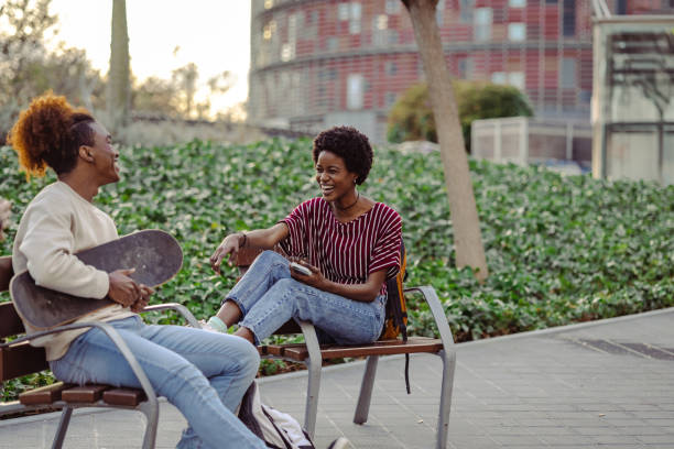 istock Young people hanging out in the park 1498390502