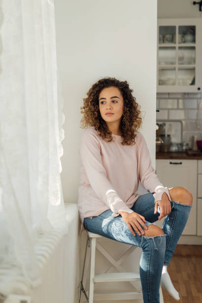 istock Beautiful young woman posing at home 1498392553