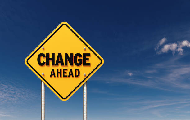 istock Change Ahead Written Yellow Off Road Traffic Sign  Before Blue Sky 1498394326