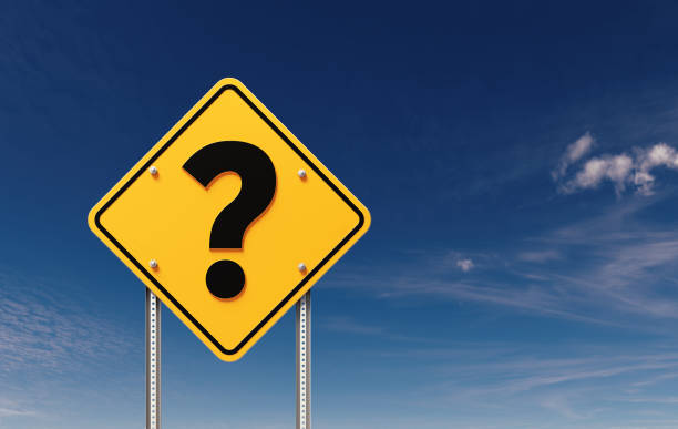 istock Yellow Off Road Traffic Sign With Question Mark Before Blue Sky 1498394445