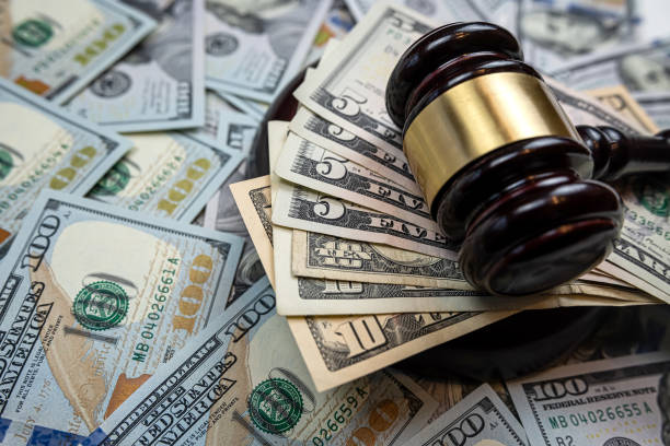 istock US 100 dollars bills with law gavel, legal issues 1498394617