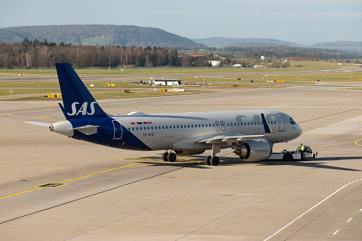Zurich, Switzerland, January 2, 2023 SAS Scandinavian airlines Airbus A320-251N aircraft is pushed back from the gate