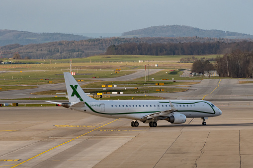 Zurich, Switzerland, January 2, 2023 Embraer Lineage 1000 business aircraft is taxiing to its takeoff position