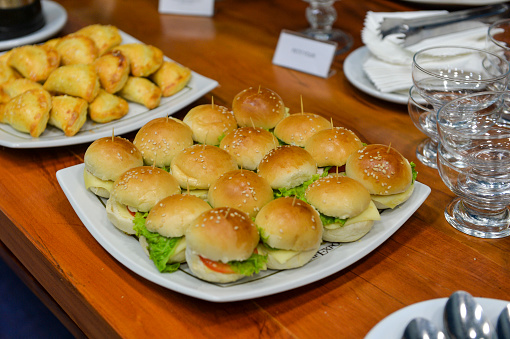 Mini sandwich types to serve at a party on a tray on the table