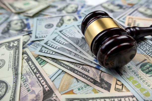 istock 100 dollar bills with judge hammer 1498400993