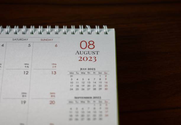 istock a close up of an open calendar on a wooden surface 1498402003