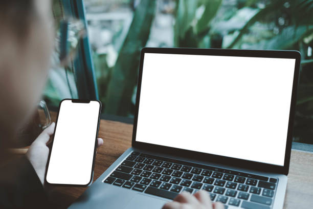 istock Woman computer,cell phone blank screen for hand typing text 1498406352