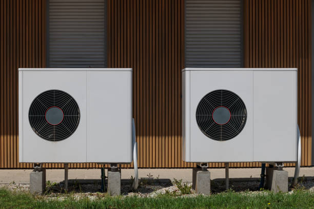 istock Air source heat pumps featured on modern house front. Renewable energy concept 1498414323