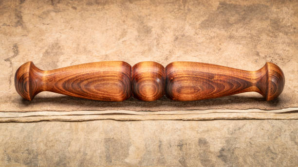 istock Wooden Tai Chi ruler, a  traditional Chinese exercise tool, on textured bark paper 1498414428
