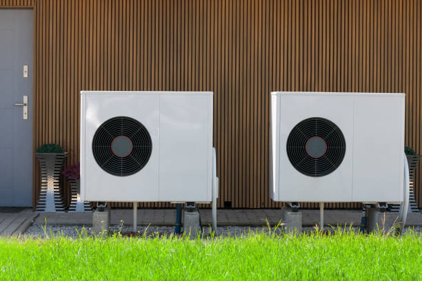 istock Modern house front with installed air source heat pumps. Concept of renewable energy. 1498414802