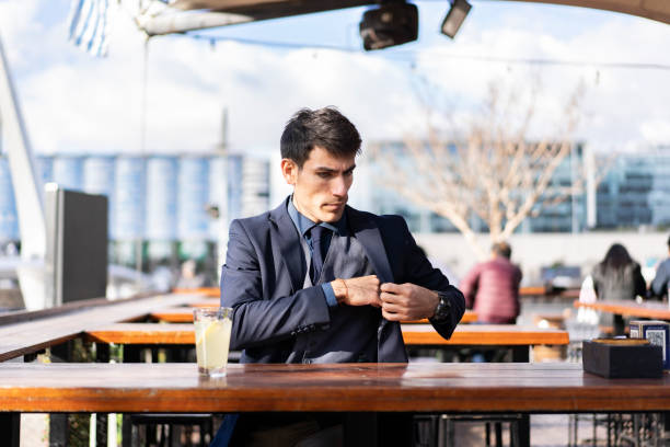 istock A pensive man looking for his smartphone in his pocket to check something 1498422012