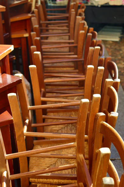 istock pile of wooden chairs- 1498424835