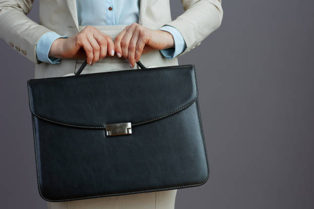 istock Closeup on female worker in light business suit 1498432084