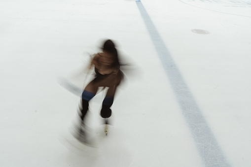 Pair of figure skates on ice, flat lay