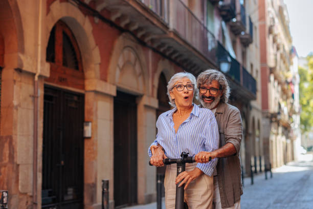 istock Senior married couple on electric scooter. 1498435550