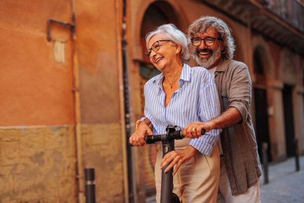 istock Affectionate pensioners riding electric scooter. 1498435558