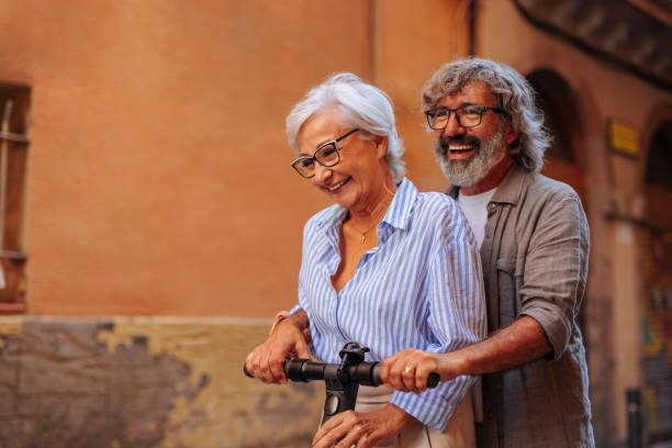 istock Retired couple on electric scooter. 1498435566