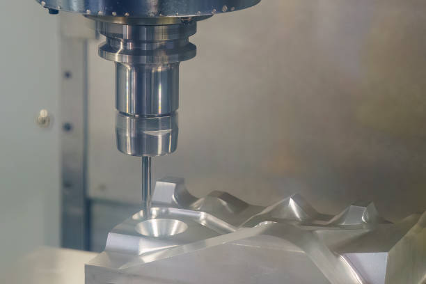 istock The CNC milling machine cutting injection mold part with ball end mill tool. 1498440887
