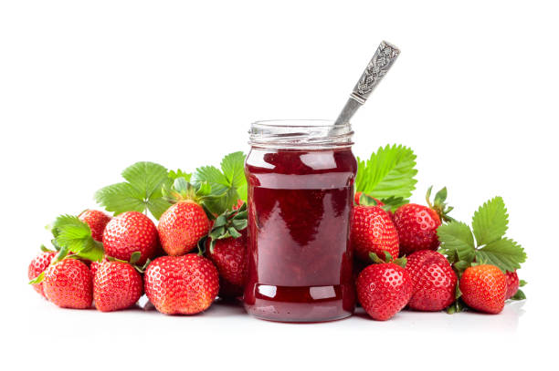 istock Strawberry jam and fresh berries are isolated on a white background. 1498442653