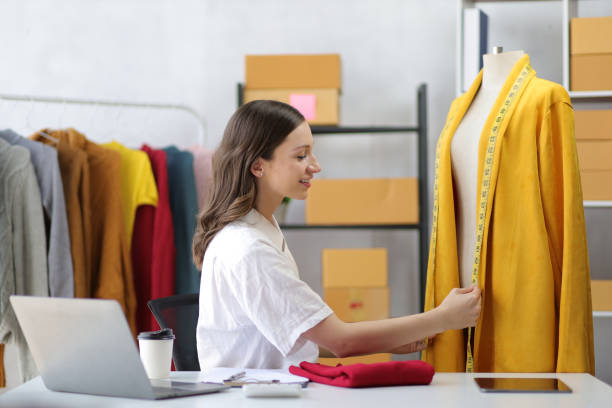 istock Fashion designer working in design studio. 1498443124