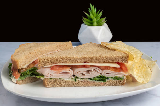 istock turkey  sandwich  with lettuce tomato and cheese 1498444239