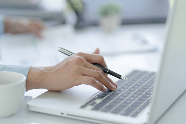 istock Business man working using laptop computer Hands typing keyboard. Professional investor working start up project. business planning in office. Technology business Concept 1498444758