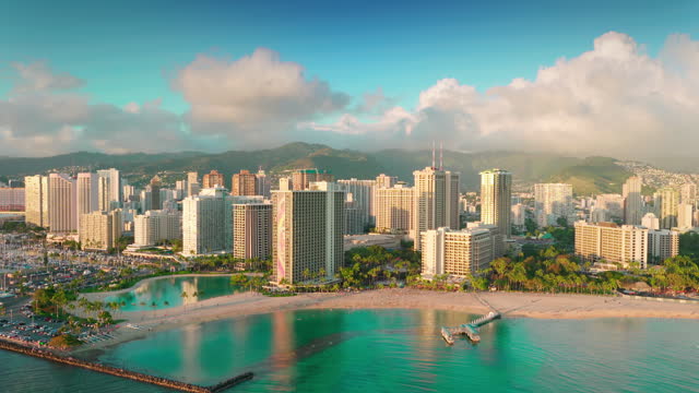 Aerial view of the magnificent tropical beaches and luxury hotels throughout the shoreline in Oahu island and the Kahanamoku Beach. Hawaii. U.S.