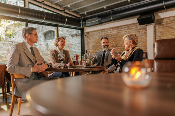 istock Businesspeople socializing in cafe. 1498451831