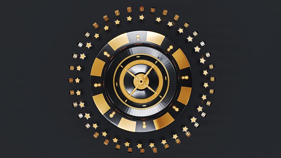 A wooden casino roulette wheel in a luxurious gold and black color