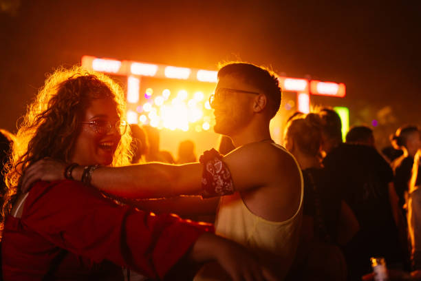 istock Friends bonding at concert 1498452606