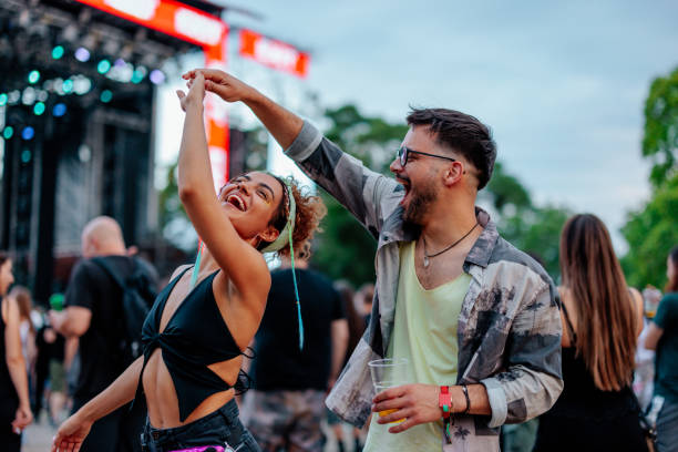 istock Dancing couple at concert 1498453054