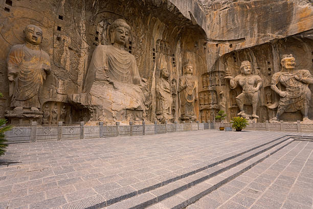 Intricately carved oversized statues at Longmen Grottoes, a UNESCO World Heritage Site in China