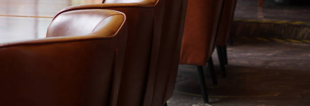 Leather sofa chairs lounge cafe restaurant interior banner with copy space