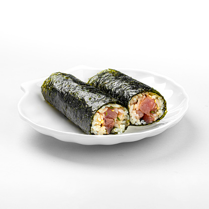Portion of uncut tuna maki sushi rolls on white background