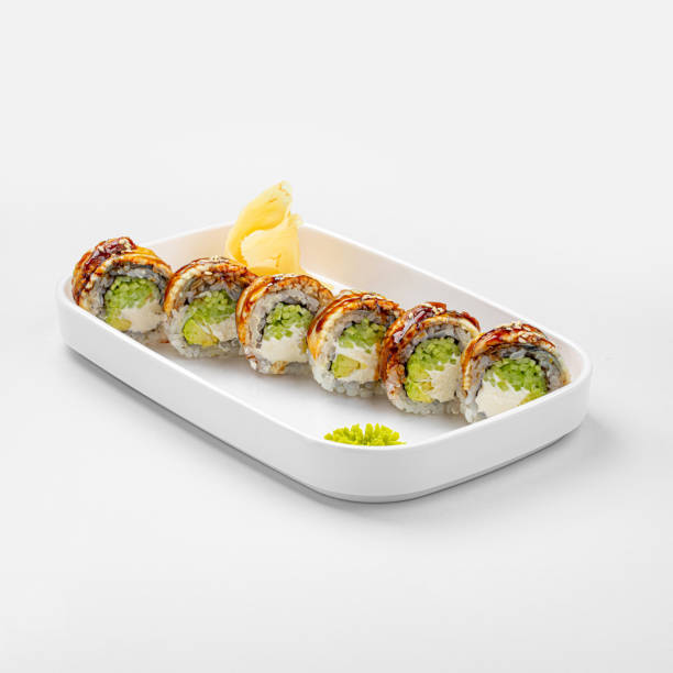 istock Portion of dragon sushi rolls with eel and sauce 1498455758