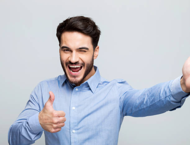 istock Happy young businessman taking selfie 1498456359