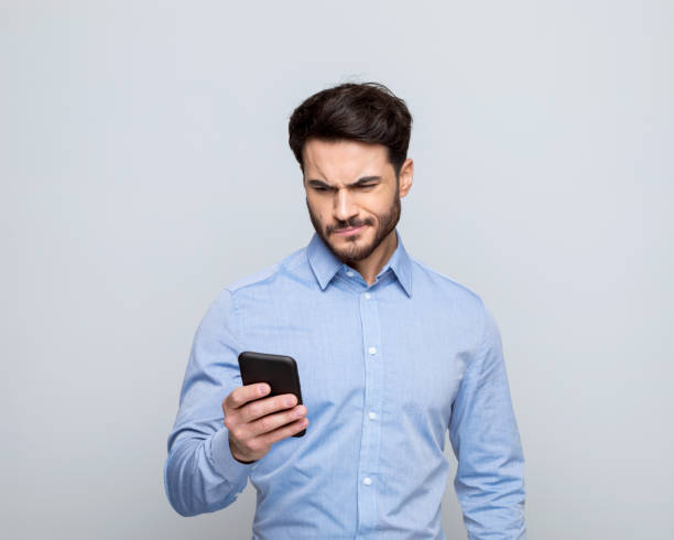 istock Worried businessman using phone 1498457165