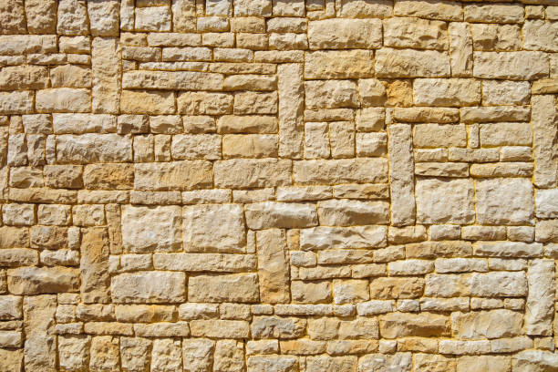 istock sandstone, brick, stone, supporting, retaining, wall, yellow, support, architecture, culture, slab, detail, sand, sandy, texture, textured, textural, background, backdrop, rows, seam 1498457902