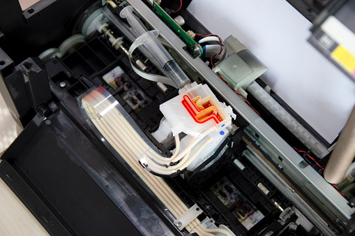 Top view inside the printer repairing a problem color.