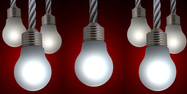 istock Panoramic of suspended lighted electric bulbs  Indoor shot 1498461352