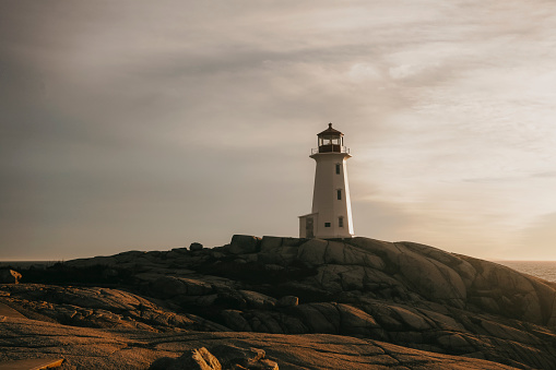 The lighthouse during sunset at Peggy's Cove, along the coast of Nova Scotia, Canada. Shot with a Canon 5D Mark IV.